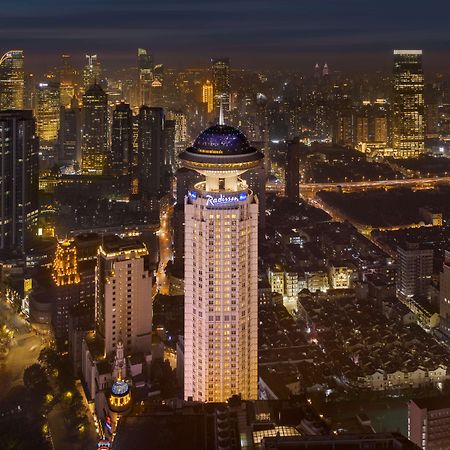 Radisson Blu Hotel Shanghai New World Exterior photo The Four Seasons Hotel, one of the first LEED Platinum certified hotels in the world